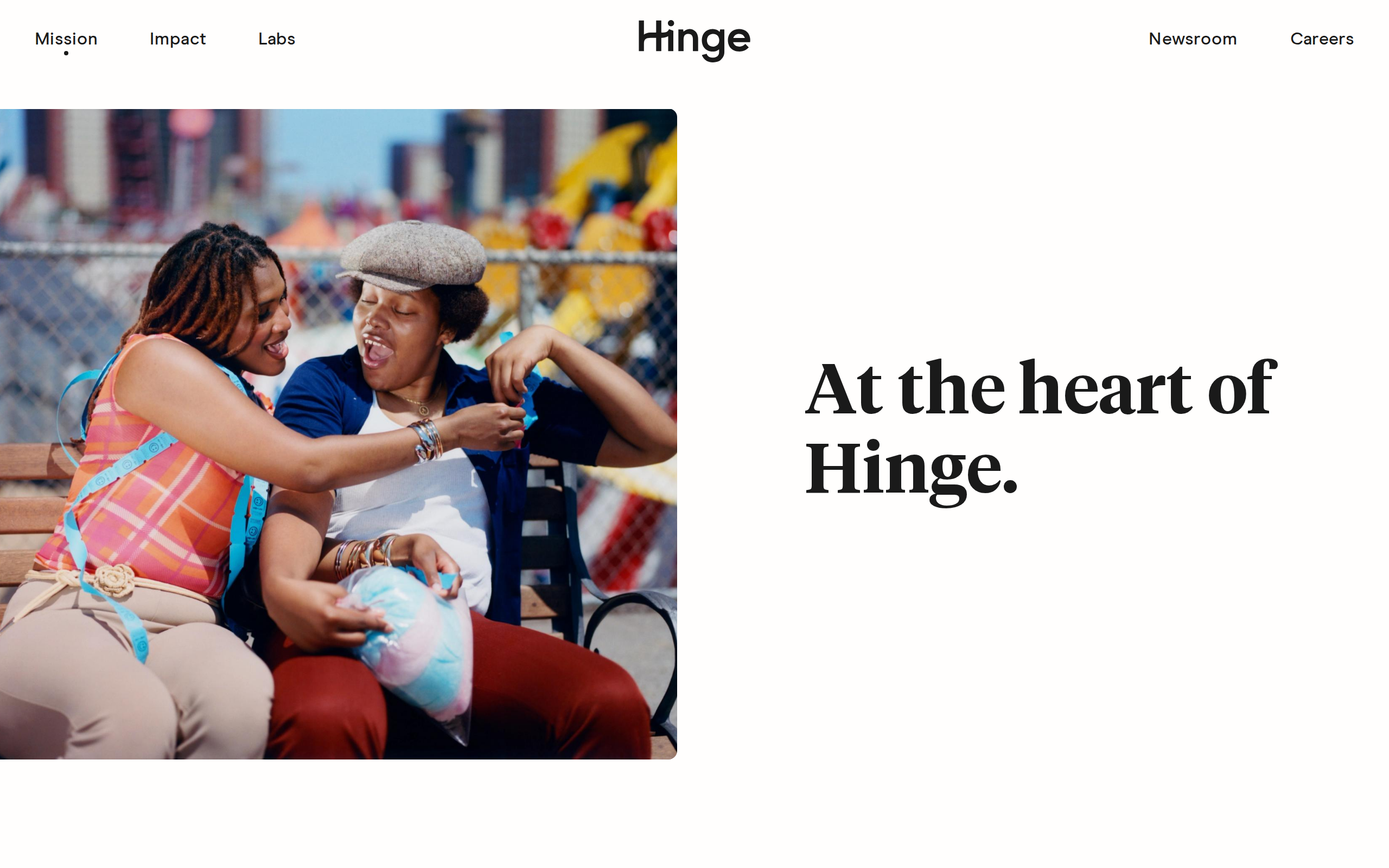 Hinge mission page headed 'At the heart of Hinge.' beside a photo of two people laughing together on a boardwalk bench.